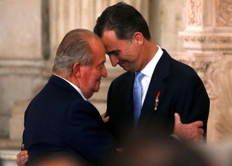 FILE PHOTO: Spain’s King Juan Carlos and his son Crown