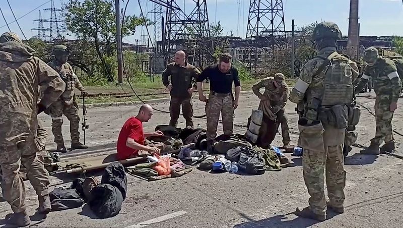 Service members of Ukrainian forces who have surrendered after weeks