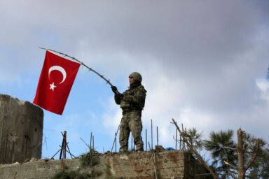 FILE PHOTO: A Turkish soldier waves a flag on Mount