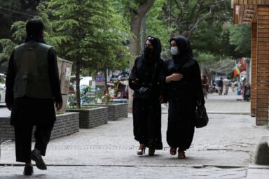 FILE PHOTO: Afghan women walk on a street in Kabul