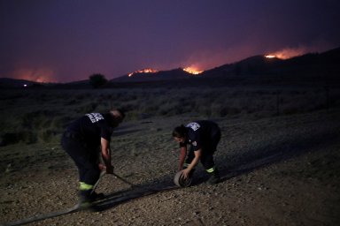 FILE PHOTO: Personnel from Fire and Rescue NSW work as