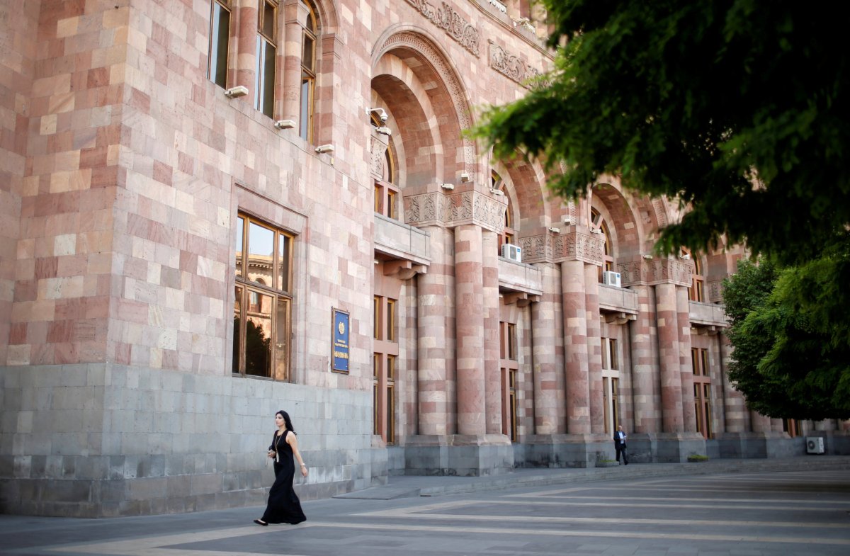FILE PHOTO: A woman walks in front of the government