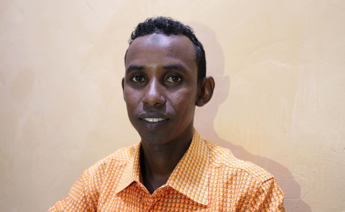 Mohamed Omar Abukar, a Somali student, talks during an interview