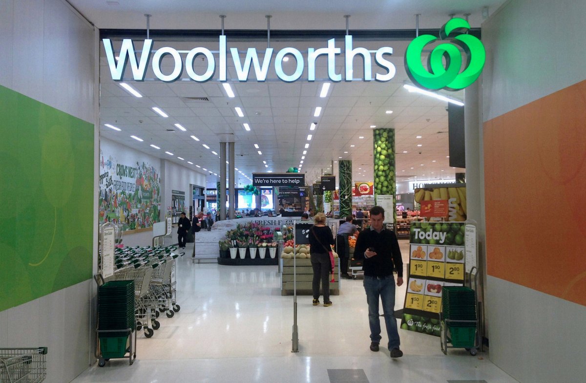 FILE PHOTO: A shopper walks out of a Woolworths store