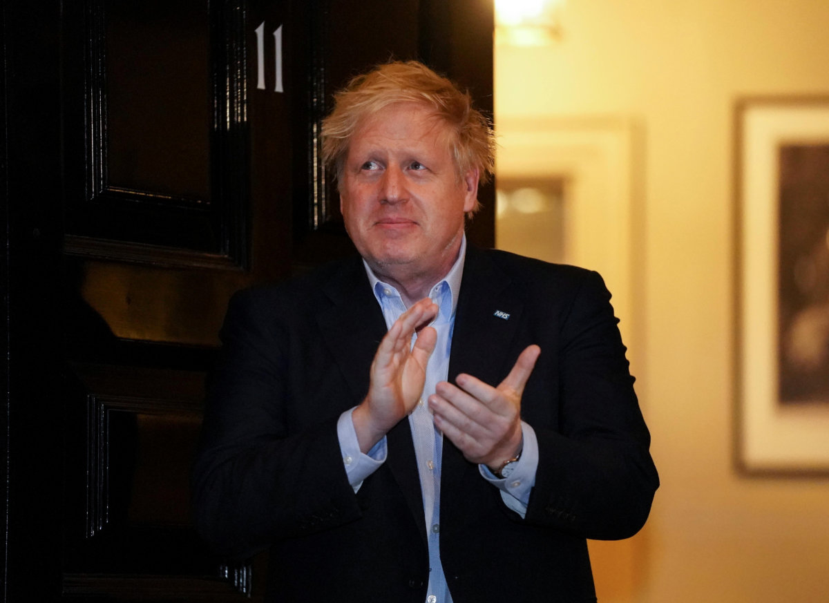 Britain’s PM Johnson applauds in support of NHS outside 11