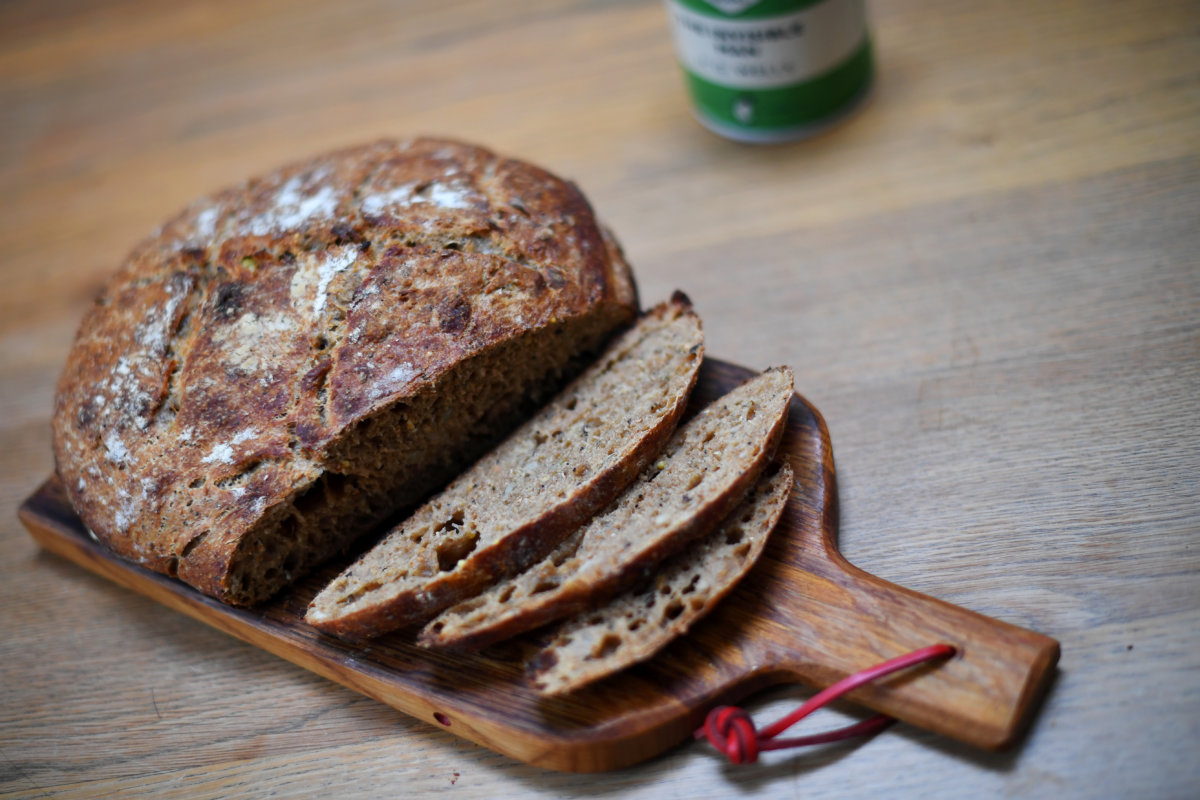 A first-attempt at a homemade seeded sourdough loaf is seen