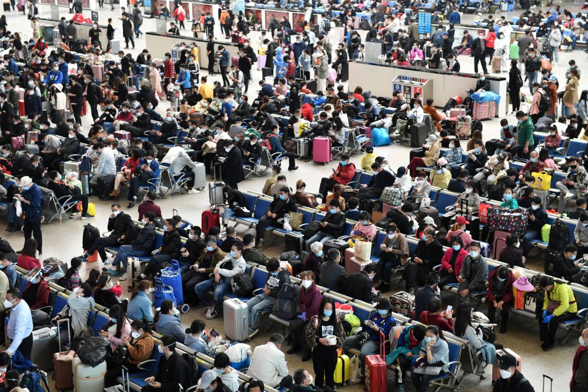 Travellers are seen inside Hankou Railway Station in Wuhan