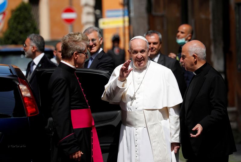 FILE PHOTO: Pope Francis leaves after leading a Mass and