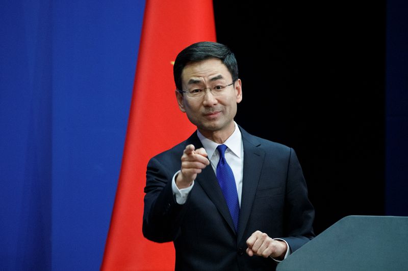 Chinese Foreign Ministry spokesman Geng Shuang takes a question from