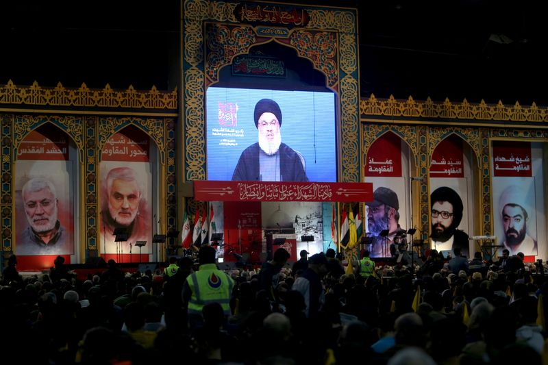 Lebanon’s Hezbollah leader Sayyed Hassan Nasrallah addresses his supporters through