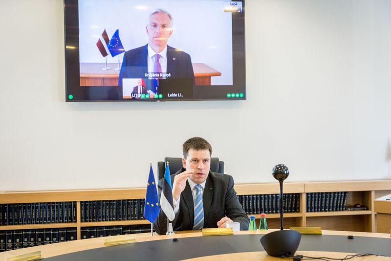 Estonian Prime Minister Ratas attends a video call with his