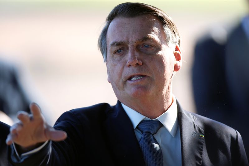 Brazil’s President Jair Bolsonaro gestures as he leaves Alvorada Palace,