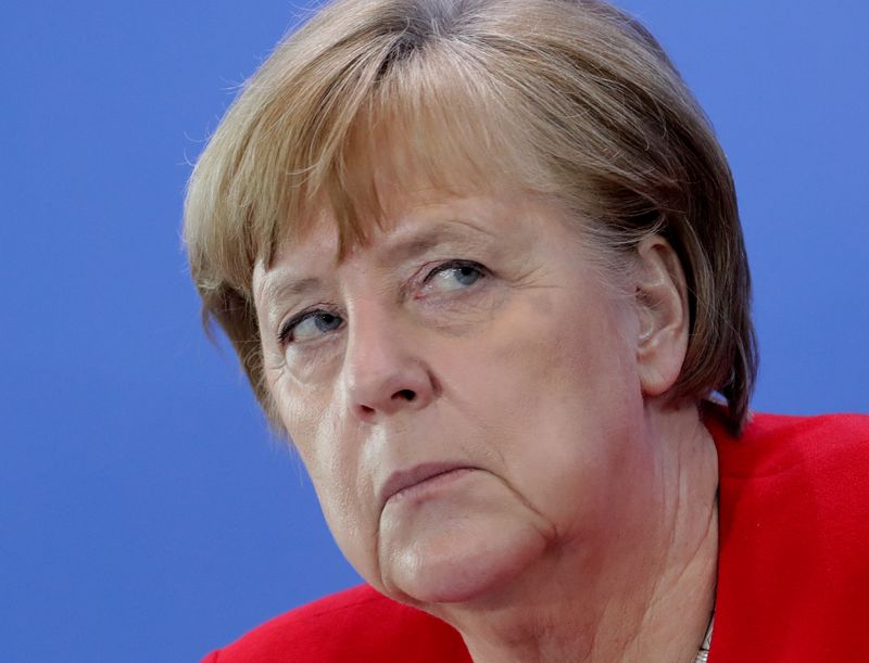FILE PHOTO: German Chancellor Merkel speaks on COVID-19 measures after