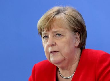 FILE PHOTO: German Chancellor Merkel speaks on COVID-19 measures after