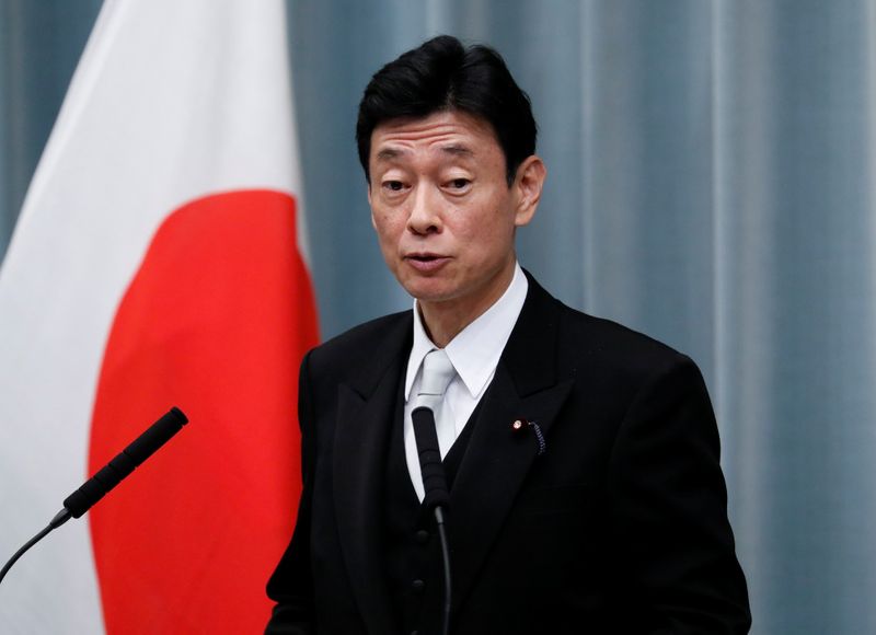 FILE PHOTO:  Japan’s Economy Minister Nishimura attends a news