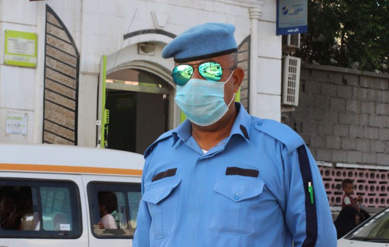A police officer wearing a protective face mask is pictured
