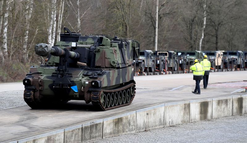 FILE PHOTO: Soldiers of German Army Bundeswehr load a U.S.