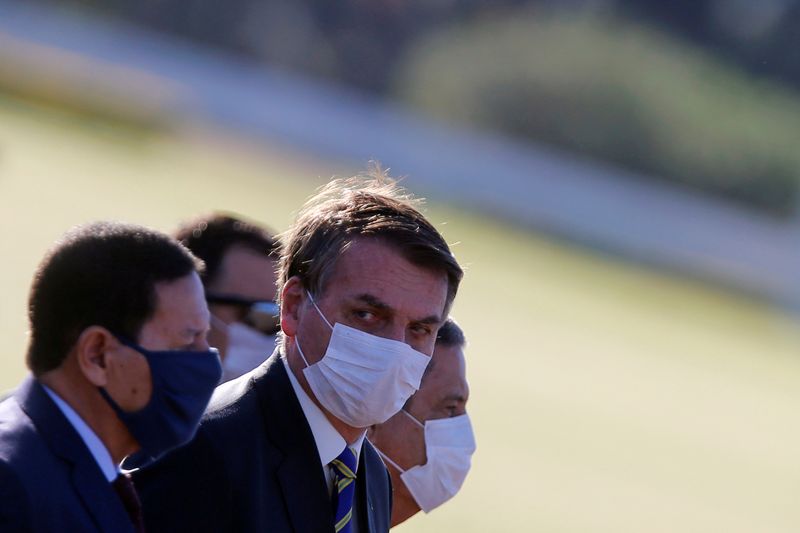 Brazil’s President Jair Bolsonaro wearing a protective mask and other