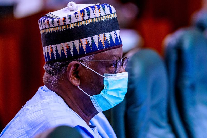 Newly appointed chief of staff, Ibrahim Gambari, wears a mask