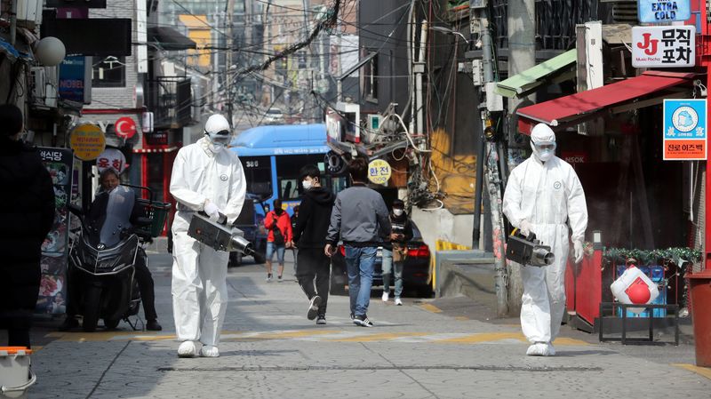 Quarantine workers spray disinfectants at night spots of Itaewon neighborhood,