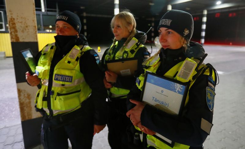 Estonian police and border guard officers hold diplomas at border