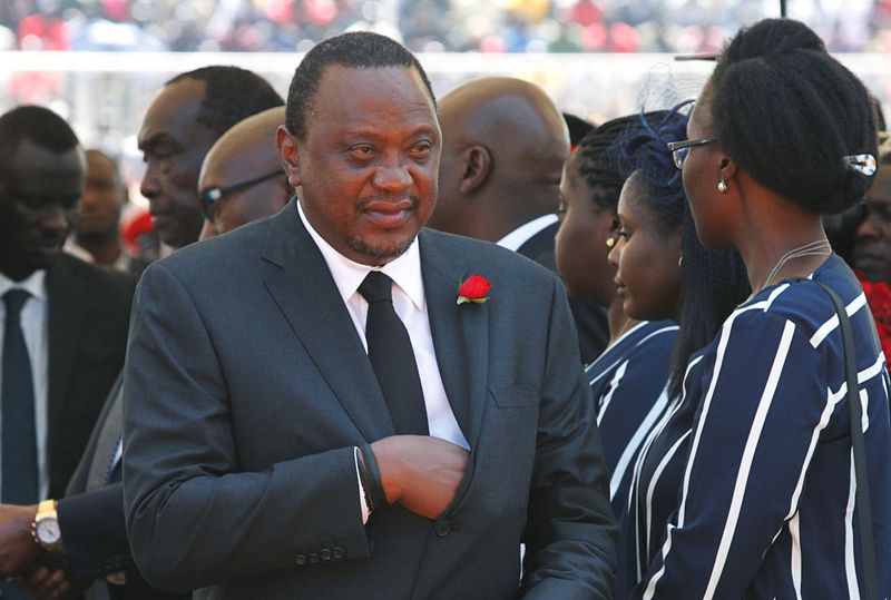 Kenya’s President Uhuru Kenyatta arrives for a memorial service for