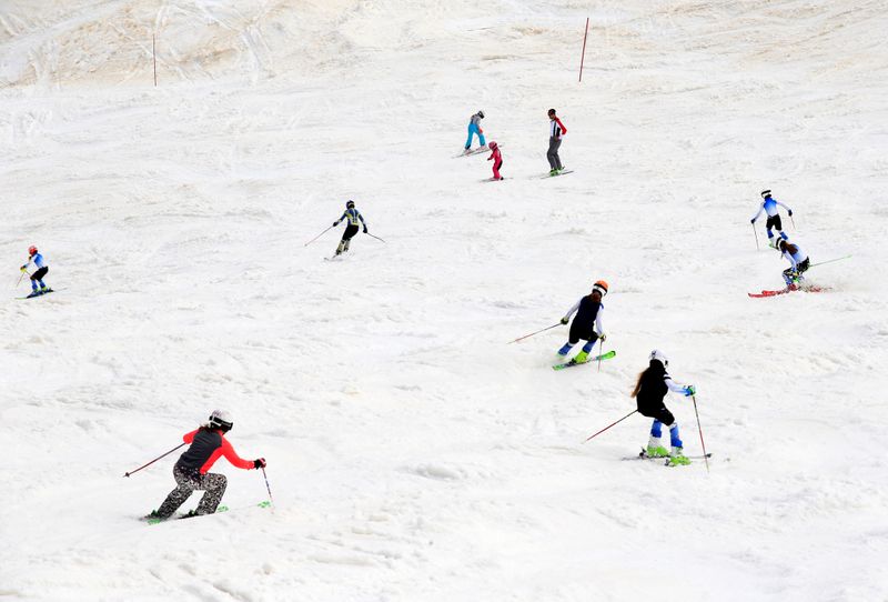 People ski on the slopes of Kanin after the Slovenian
