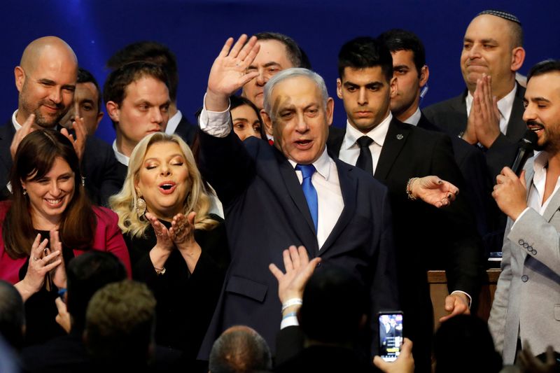 FILE PHOTO: Israeli Prime Minister Benjamin Netanyahu stands next to