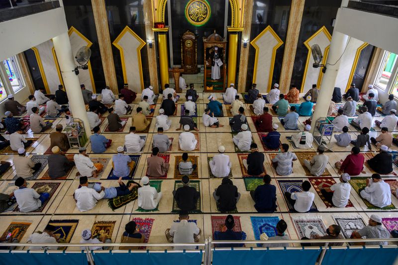 Indonesian Muslims men take part in prayers during Eid al-Fitr