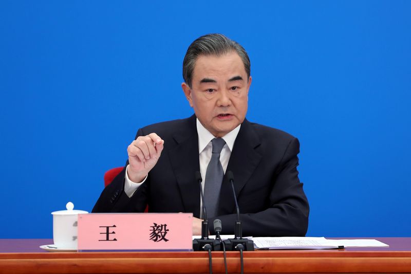 Chinese State Councillor and Foreign Minister Wang Yi speaks to