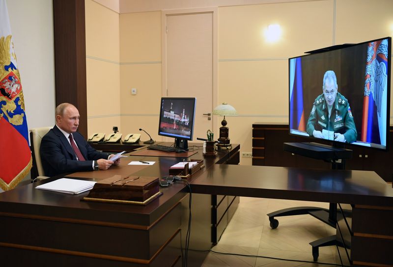 Russia’s President Putin takes part in a video conference call