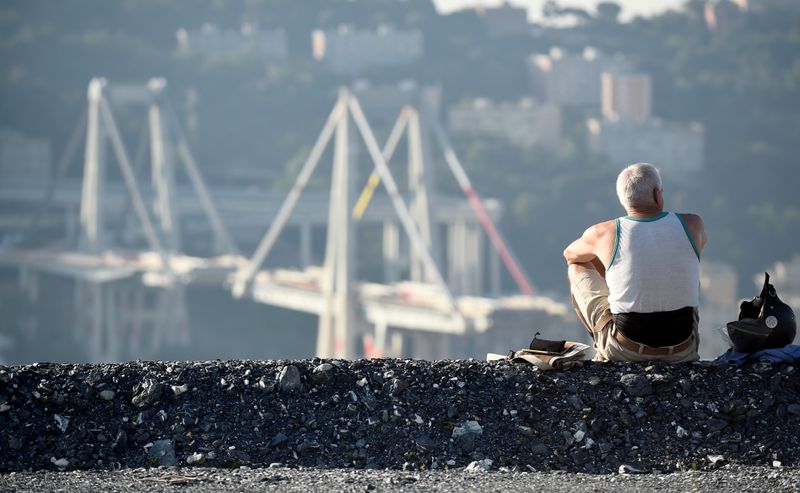 FILE PHOTO: A man looks at Morandi Bridge, before controlled