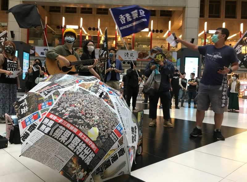 FILE PHOTO: Protesters holding banners in support of Hong Kong