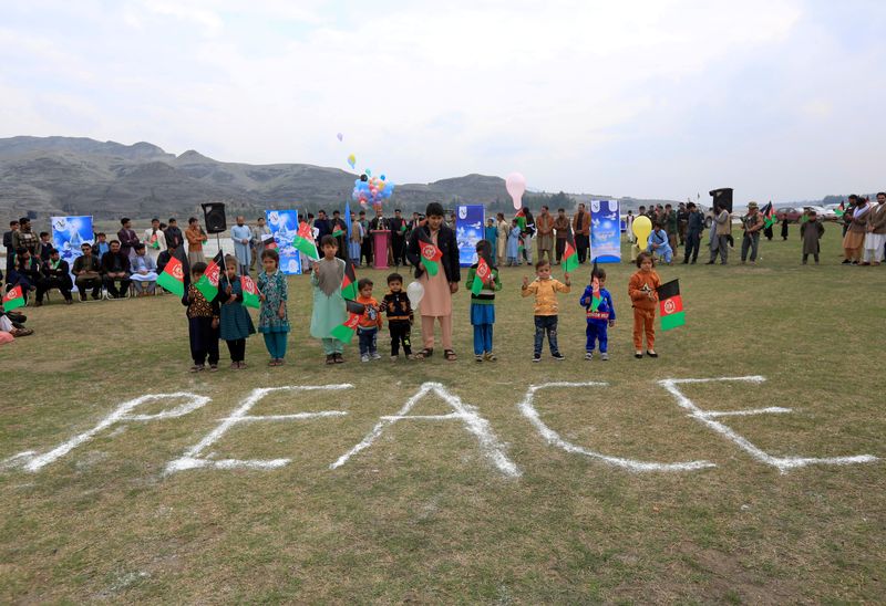 FILE PHOTO: Afghan children celebrate in anticipation of the U.S-Taliban