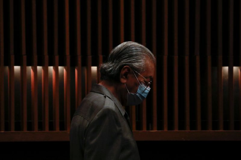 FILE PHOTO: Malaysia’s former Prime Minister Mahathir Mohamad wearing protective