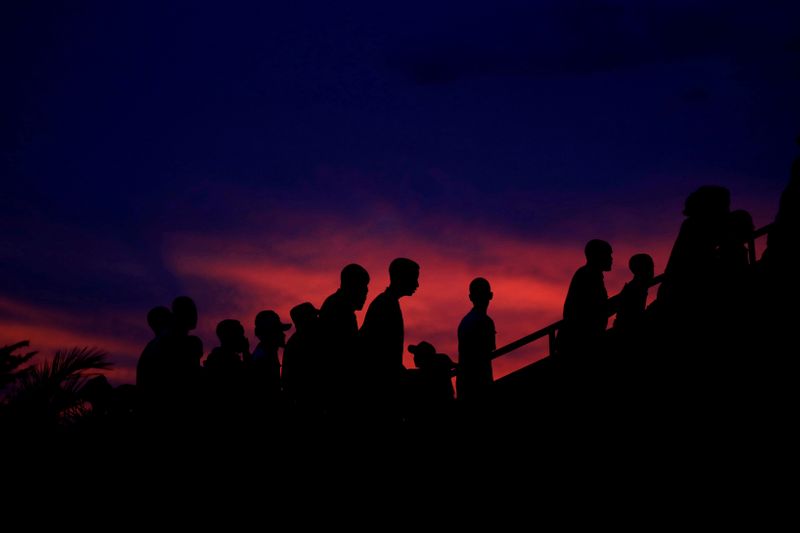 FILE PHOTO: Participants arrive to a night vigil during a
