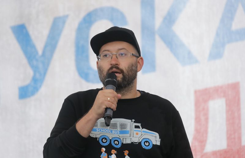 Russian journalist Azar attends a rally to demand authorities allow