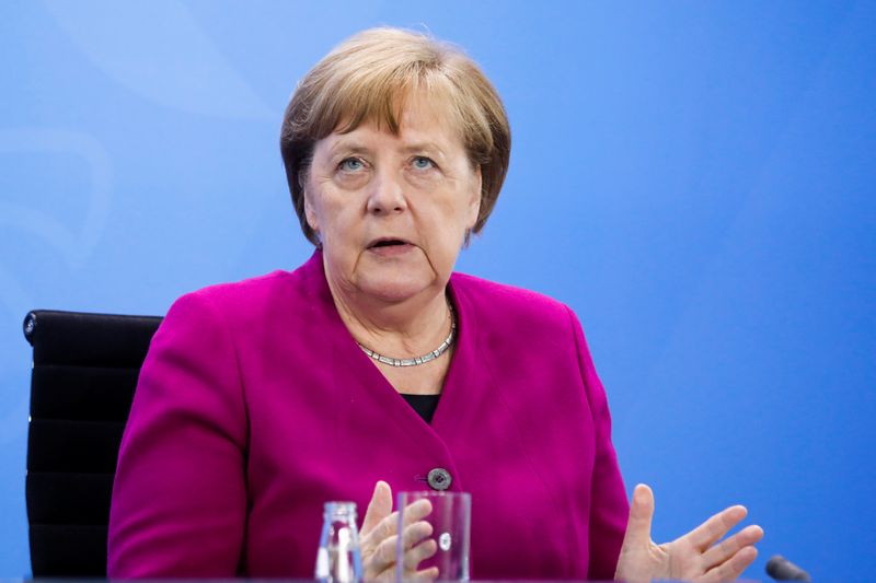 German Chancellor Angela Merkel briefs the media after a meeting