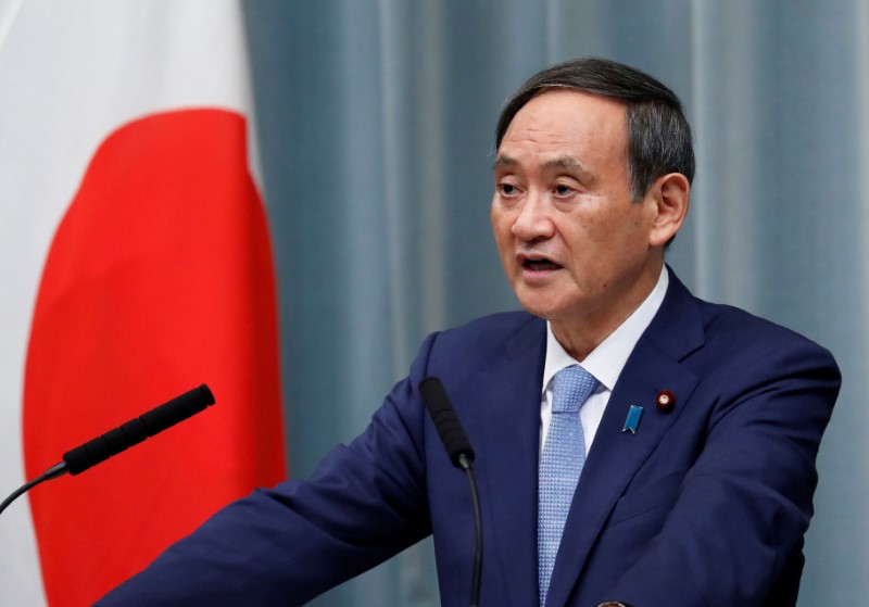 Japan’s Chief Cabinet Secretary Suga speaks at a news conference