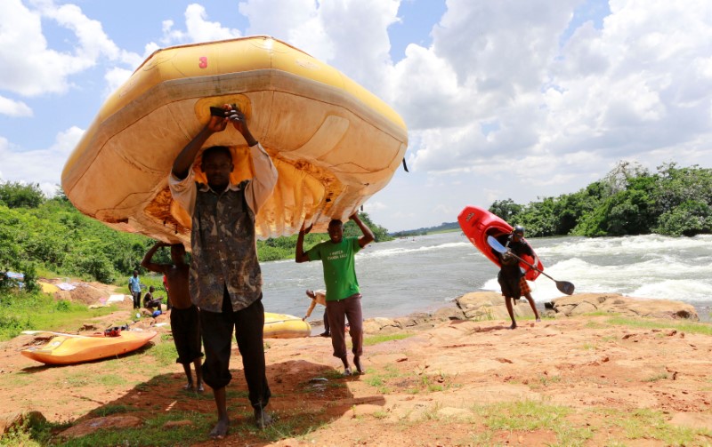 FILE PHOTO: Men carry rafts and kayaks used during white