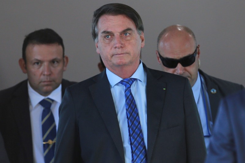 Brazil’s President Jair Bolsonaro walks after a meeting at the