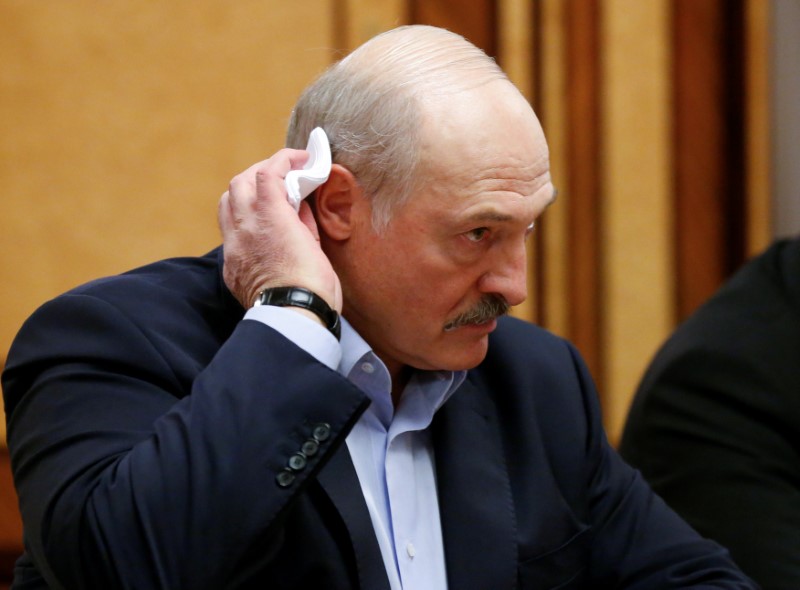 FILE PHOTO: Belarusian President Alexander Lukashenko listens to Russian President