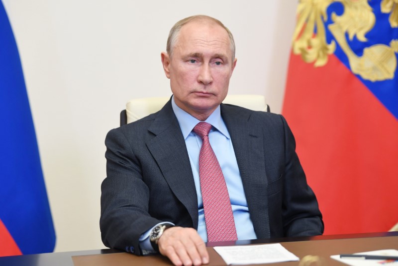 FILE PHOTO:  Russian President Vladimir Putin takes part in a