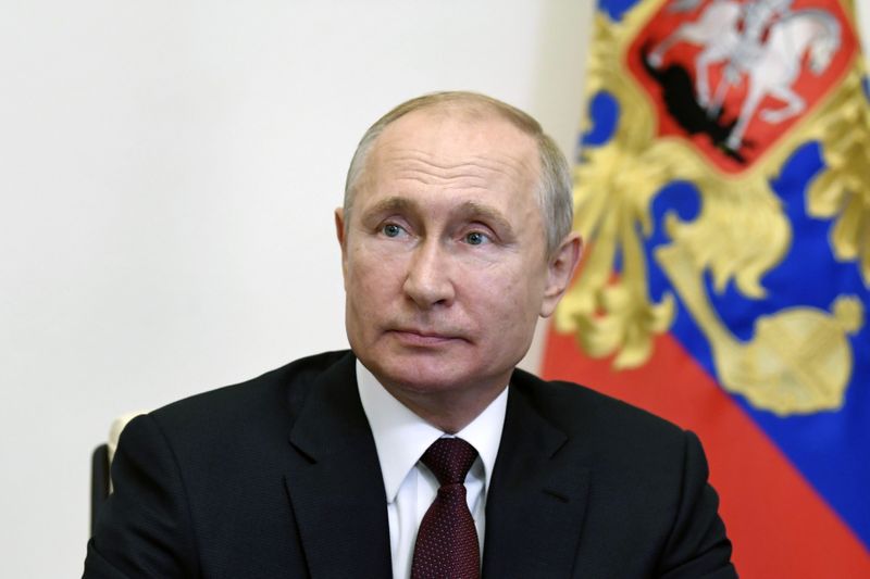 FILE PHOTO:  Russia’s President Putin takes part in a