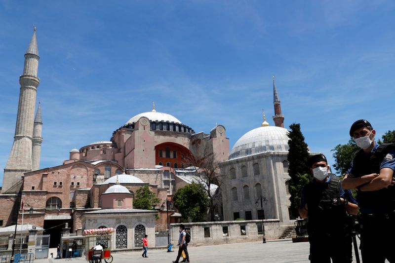 Turkish police officers wearing face masks patrol at touristic Sultanahmet