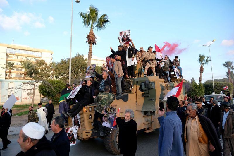 FILE PHOTO: Supporters of Libyan National Army (LNA) commanded by