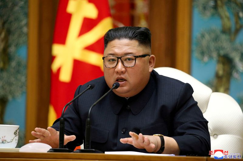 FILE PHOTO: North Korean leader Kim Jong Un takes part