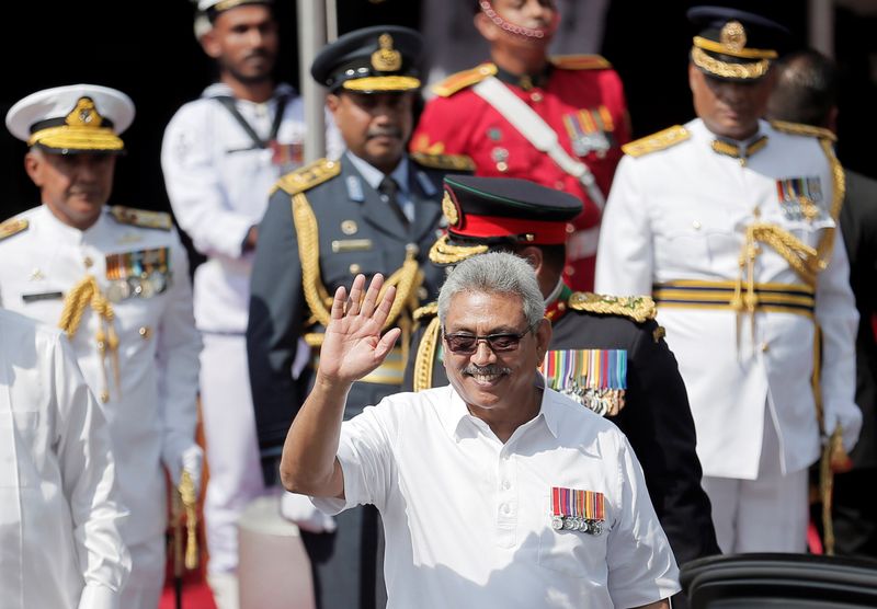Sri Lanka’s President Rajapaksa waves during the 72nd independence day