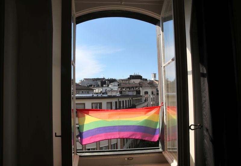 A rainbow flag is pictured on the window at Vogay