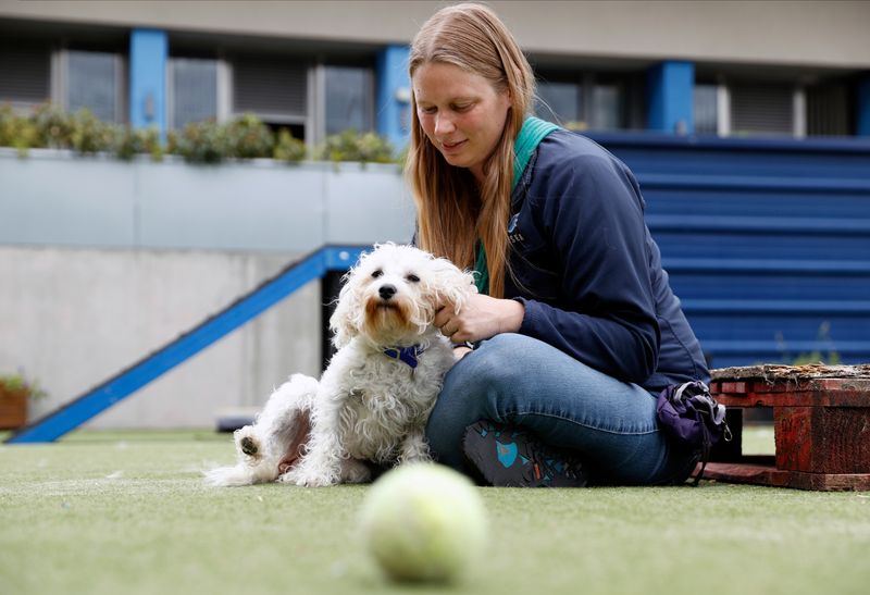 Rehoming and Welfare Assistant Marina Elands takes Charlie, a Bichon